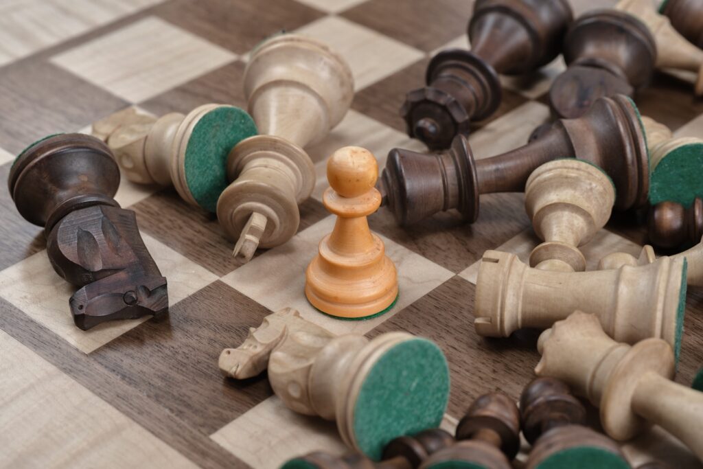 closeup photo of gray and brown chess board set