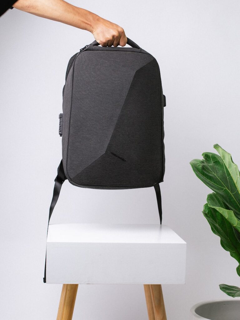 black backpack on white box